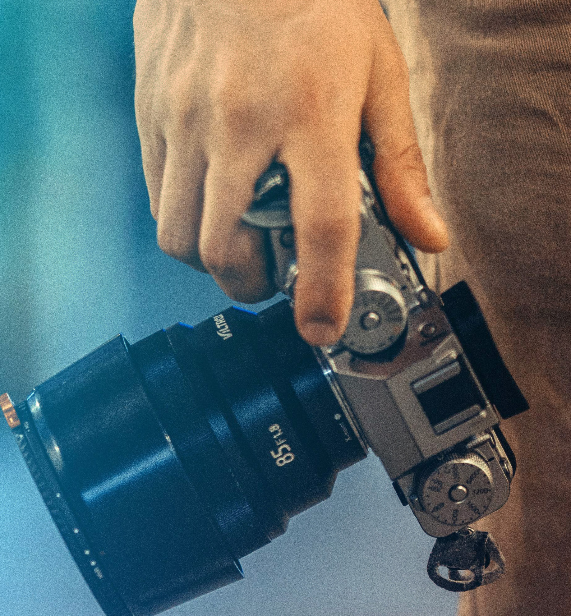 Close view of a person adjusting the controls on a camera